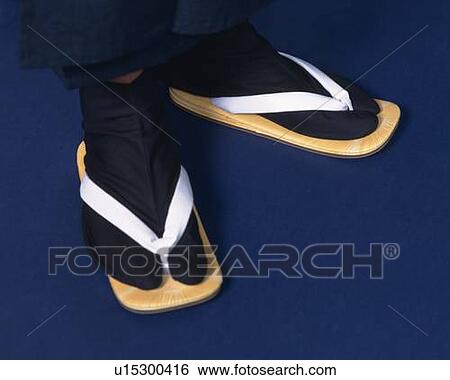 Stock Photograph - Feet of a man in kimono, High Angle View, Close Up. Fotosearch