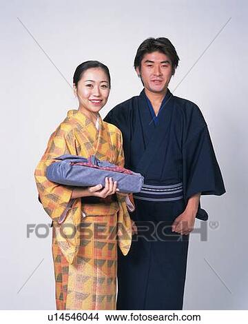 Man and woman in kimono smiling, Front View View Large Photo Image Picture - Man and woman in kimono smiling, Front View. Fotosearch