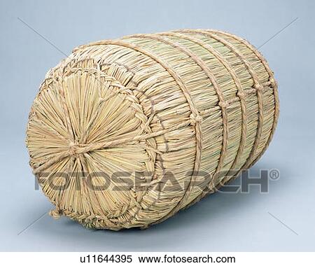 Stock Photography - A bale of rice, high angle view, blue background . Fotosearch