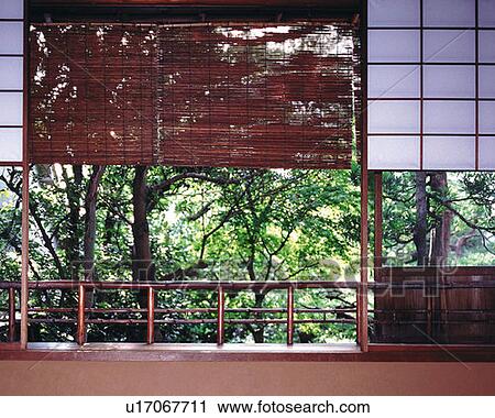 Stock Image - Bamboo blinds in a Japanese style room, Japan. Fotosearch