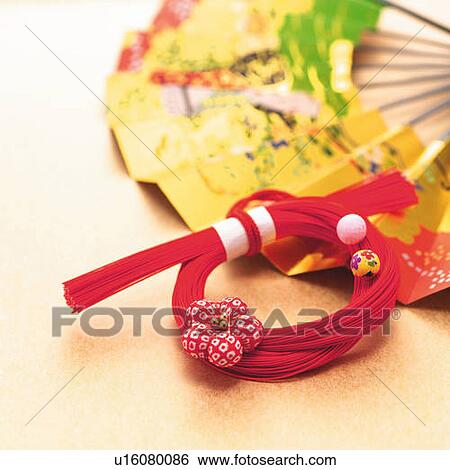 Bunch of red strings and Japanese folding fan, high angle view, orange background, differential focus View Large Photo Image Stock Photograph - Bunch of red strings and Japanese folding fan, high angle view, orange background, differential focus. Fotosearch