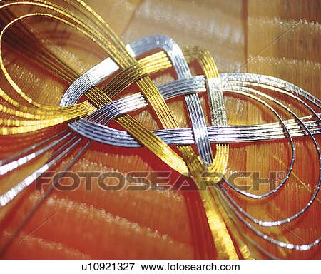 Gold and silver strings, high angle view, close up View Large Photo Image Stock Photo - Gold and silver strings, high angle view, close up. Fotosearch