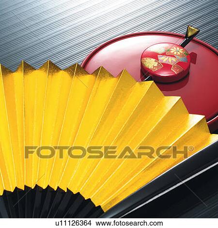 Picture - Japanese folding fan and hairpin on hand mirror, high angle view. Fotosearch