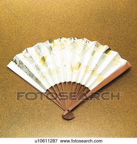 Stock Photo - Japanese folding fan, front view, gold background. Fotosearch