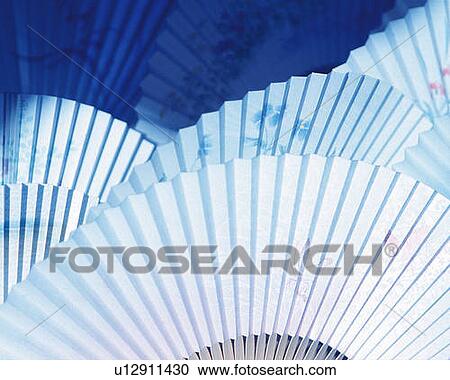 Stock Image - Japanese folding fans, high angle view, full frame. Fotosearch