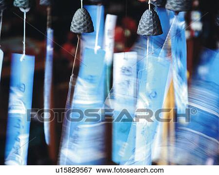 Mass of wind chimes, blurred motion, differential focus View Large Photo Image Stock Photo - Mass of wind chimes, blurred motion, differential focus. Fotosearch