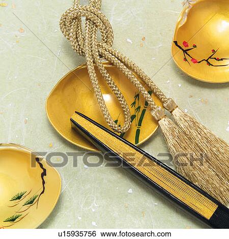 Stock Photograph - Painted clamshells and Japanese folding fan, high angle view. Fotosearch