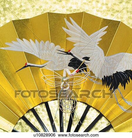 Stock Photograph - Painting of cranes on Japanese folding fan, front view, close up. Fotosearch