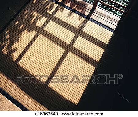 Stock Image - Shadow on Tatami mat in Japanese style room, high angle view, Japan. Fotosearch