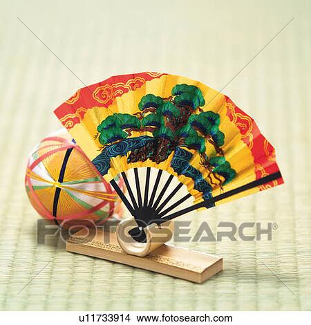 Picture - Temari ball and Japanese folding fan on Tatami mat, high angle view, Japan, differential focus. Fotosearch