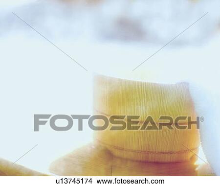 Picture - Towel on a wooden tub, Japanese wooden bath, soft focus, high key. Fotosearch