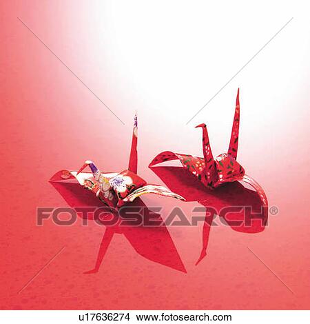 Two Origami birds, high angle view, red background, copy space View Large Photo Image Picture - Two Origami birds, high angle view, red background, copy space. Fotosearch