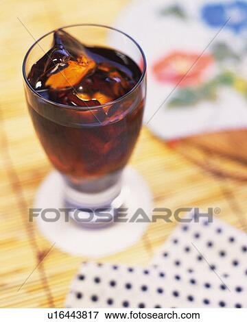 A glass of iced coffee with towel and Japanese fan, high angle view, differential focus View Large Photo Image Stock Photo - A glass of iced coffee with towel and Japanese fan, high angle view, differential focus. Fotosearch