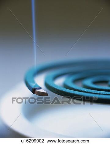 Burning coiled incense, high angle view, gray background, differential focus View Large Photo Image Stock Image - Burning coiled incense, high angle view, gray background, differential focus. Fotosearch