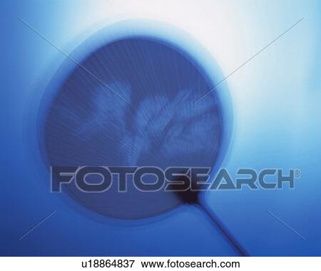 Stock Photo - Japanese fan, front view, toned image, blurred motion. Fotosearch