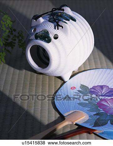 Japanese folding fan and pig-shaped incense burner, high angle view, Japan View Large Photo Image Stock Photo - Japanese folding fan and pig-shaped incense burner, high angle view, Japan. Fotosearch