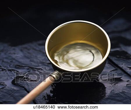 Stock Image - Ladle, high angle view, differential focus. Fotosearch