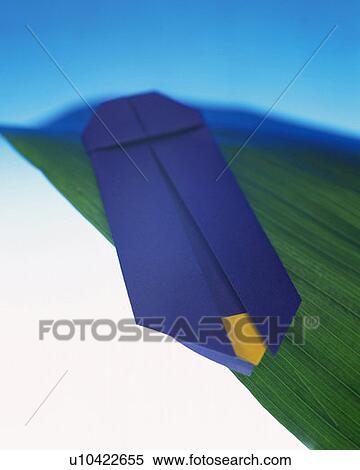 Stock Photography - Origami firefly on a leaf, high angle view, differential focus. Fotosearch