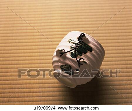 Picture - Pig-shaped incense burner on Tatami mat, high angle view, Japan. Fotosearch