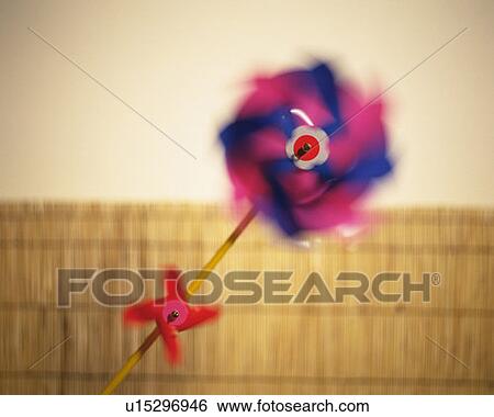 Stock Photograph - Spinning pinwheel, front view, soft focus, blurred motion. Fotosearch