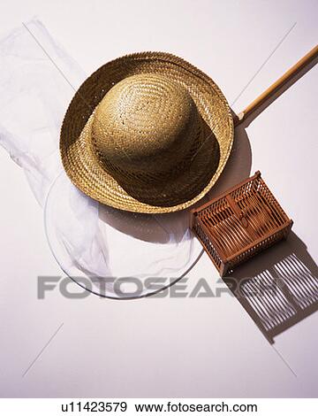 Straw hat, insect net and insect cage, high angle view, white background View Large Photo Image Stock Photo - Straw hat, insect net and insect cage, high angle view, white background. Fotosearch