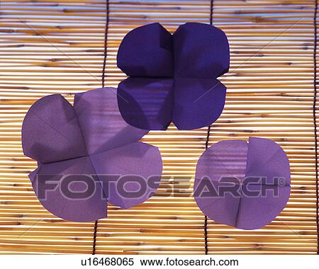 Three Origami flowers on bamboo blind, front view View Large Photo Image Stock Photography - Three Origami flowers on bamboo blind, front view. Fotosearch