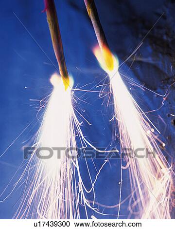 Stock Image - Two lighting fireworks, close up, differential focus, long exposure. Fotosearch