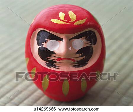Stock Photograph - Daruma on Tatami mat, high angle view, differential focus. Fotosearch