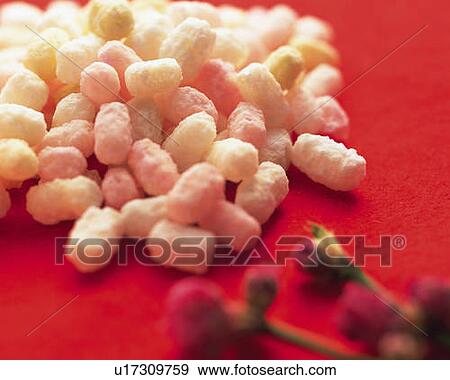 Japanese cubic rice crackers and flowers on red surface, high angle view, differential focus View Large Photo Image Stock Photo - Japanese cubic rice crackers and flowers on red surface, high angle view, differential focus. Fotosearch