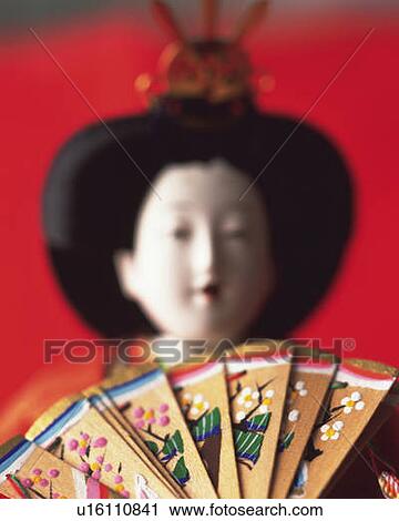 Stock Image - Japanese female figurine, front view, differential focus. Fotosearch