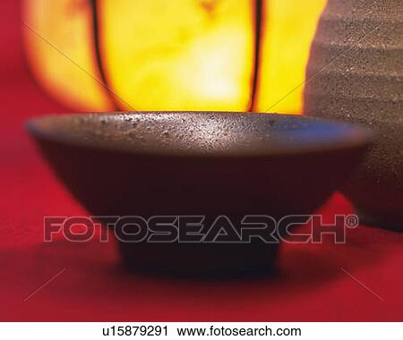 Sake in cup and bottle, front view, close up, differential focus View Large Photo Image Stock Image - Sake in cup and bottle, front view, close up, differential focus. Fotosearch