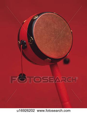 Toy of hand drum, front view, red background, differential focus View Large Photo Image Stock Image - Toy of hand drum, front view, red background, differential focus. Fotosearch