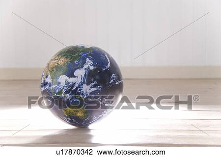 Stock Image - Globe on Floor. Fotosearch