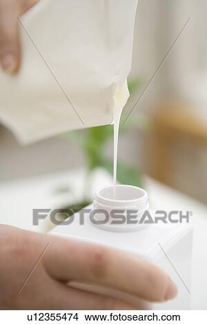 Refilling Liquid Soap View Large Photo Image Picture - Refilling Liquid Soap. Fotosearch