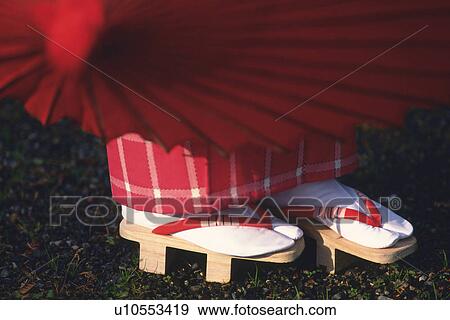 Woman putting on wooden clogs View Large Photo Image Stock Photo - Woman putting on wooden clogs. Fotosearch