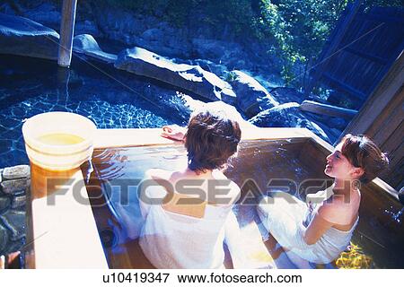 Stock Photo - Two Young Adult Women Taking a Bath. Fotosearch