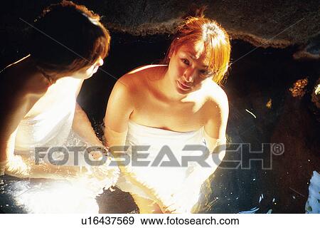 Stock Photo - Two Young Adult Women Taking a Bath. Fotosearch