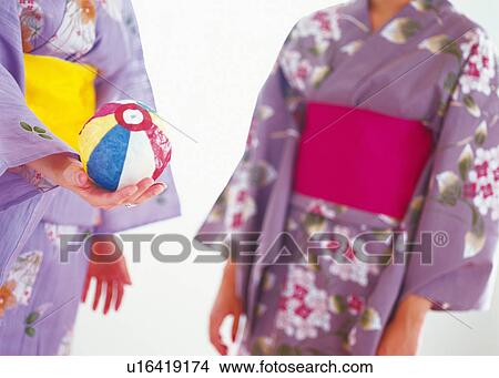 Two young Woman Playing with A Paper Balloon View Large Photo Image Picture - Two young Woman Playing with A Paper Balloon. Fotosearch