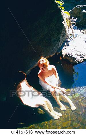 Stock Image - Two young Woman Taking a Bath. Fotosearch