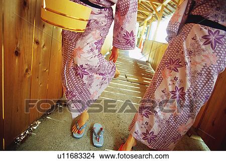 Picture - Two Young Woman Wearing A Yukata. Fotosearch