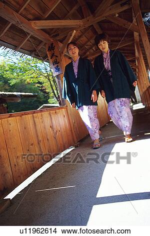 Picture - Two Young Woman Wearing A Yukata. Fotosearch