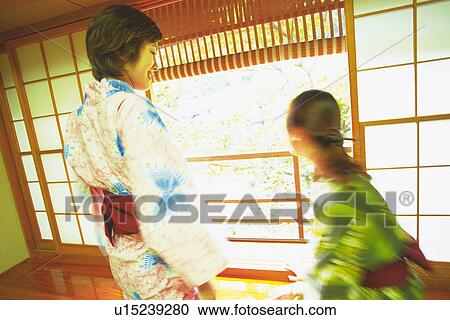 Two Young Woman Wearing A Yukata View Large Photo Image Stock Image - Two Young Woman Wearing A Yukata. Fotosearch