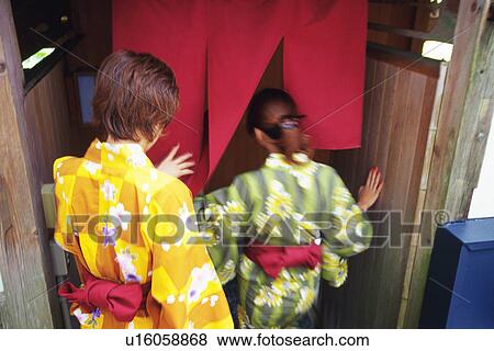 Two Young Woman Wearing A Yukata View Large Photo Image Stock Photo - Two Young Woman Wearing A Yukata. Fotosearch
