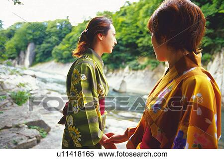 Two Young Woman Wearing A Yukata View Large Photo Image Stock Photography - Two Young Woman Wearing A Yukata. Fotosearch