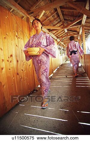 Two Young Woman Wearing A Yukata View Large Photo Image Stock Photography - Two Young Woman Wearing A Yukata. Fotosearch