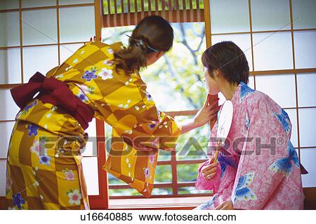 Two Young Woman Wearing A Yukata View Large Photo Image Stock Photography - Two Young Woman Wearing A Yukata. Fotosearch