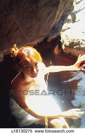 Stock Photography - Young Adult Women Taking a Bath. Fotosearch