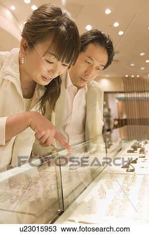 Japanese Couple Looking Of Jewelry View Large Photo Image Stock Image - Japanese Couple Looking Of Jewelry. Fotosearch
