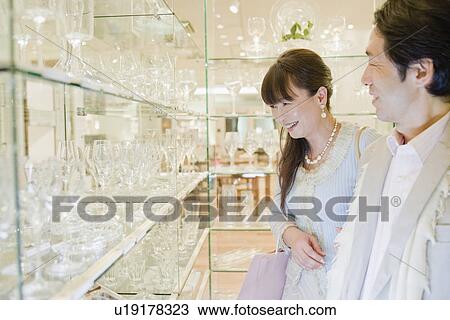 Stock Image - Japanese Couple, Shopping. Fotosearch