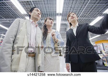 Stock Photo - Japanese Couple, Shopping. Fotosearch